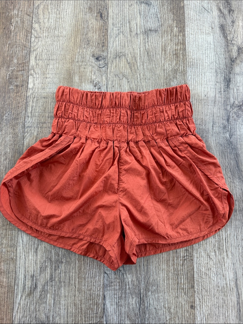 Free People Smocked High-Waist Shorts in Rust